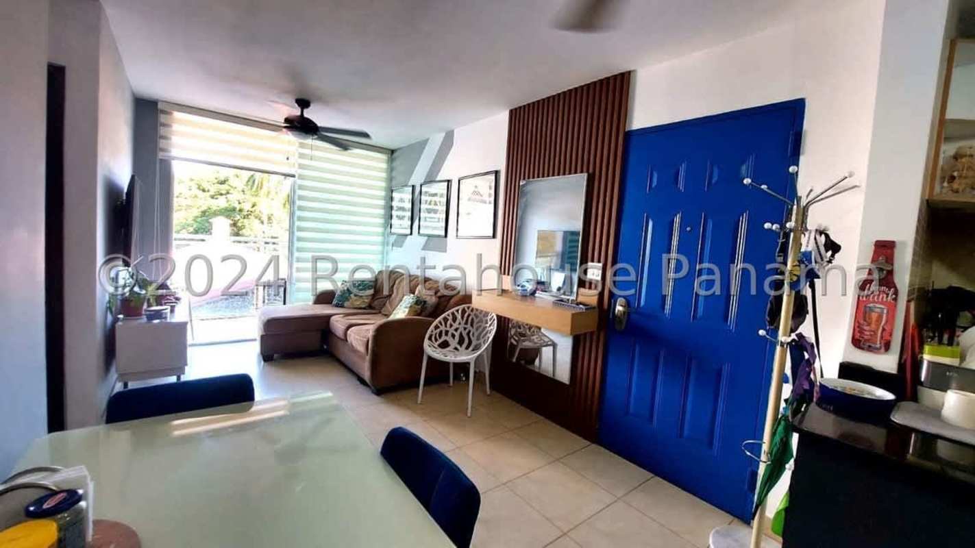 Bright living room with ceramic tile floor, sofa and access to balcony in Albrook Point Panama