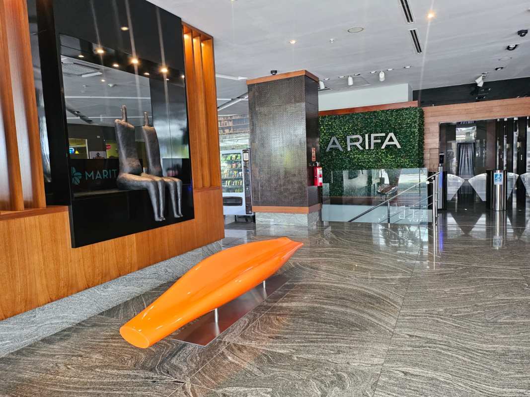 Contemporary lobby with marble floor and art installation PH Arifa Tower Santa María Panama