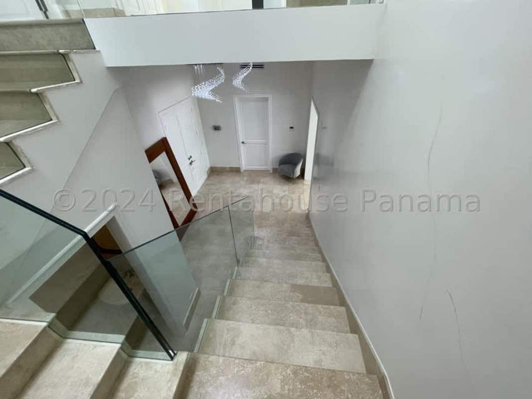 Gourmet kitchen with island, stainless appliances and marble floor in luxury villa Santa Maria Golf Panama