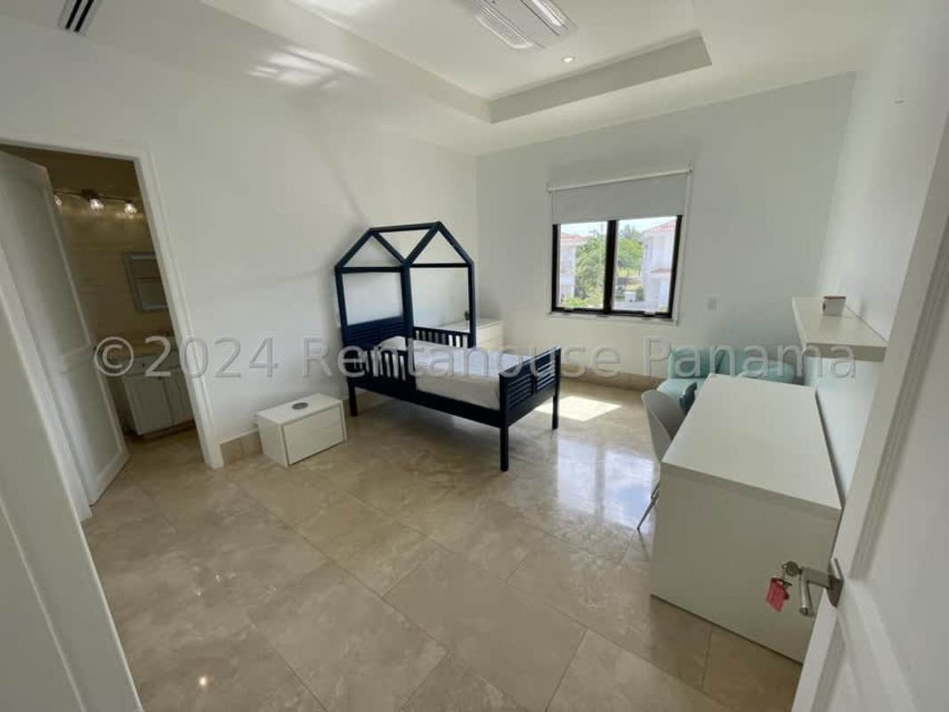 Spacious master bedroom with marble floors, balcony access, en-suite bath in Santa Maria Golf villa Panama