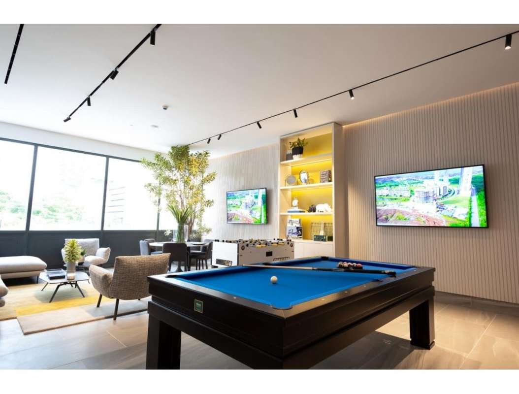 Infinity swimming pool with sun deck overlooking golf course at Ocean House Santa Maria Panama