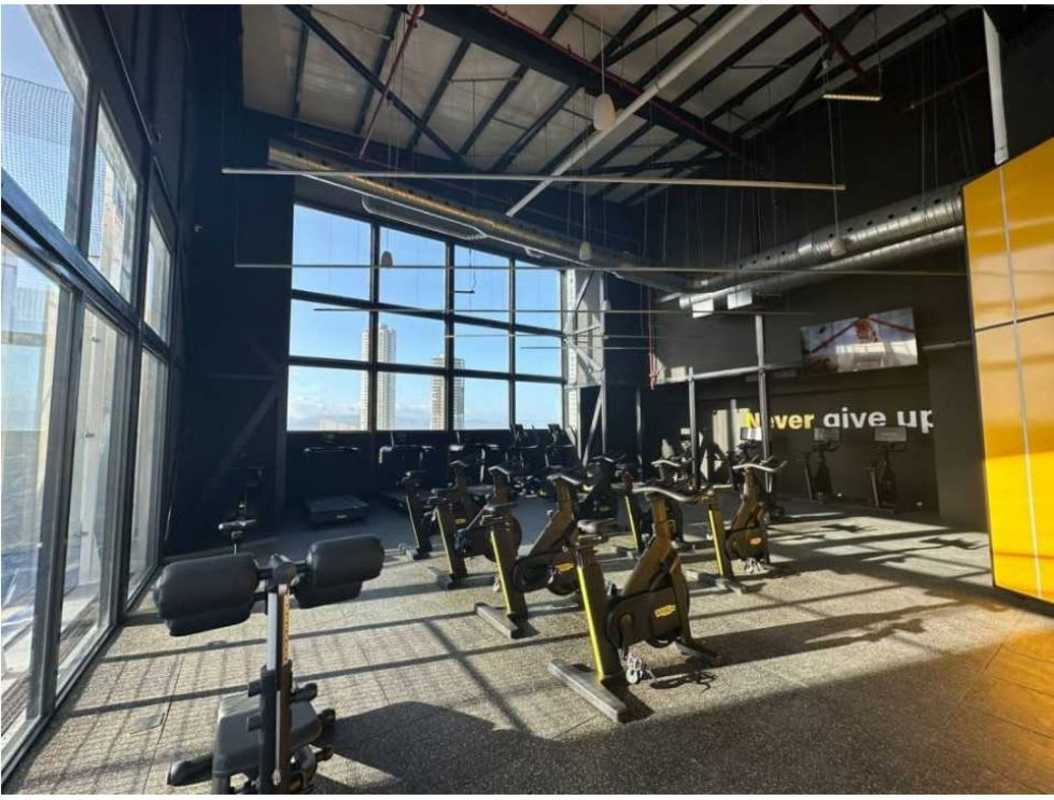 Elegant lobby with marble floors seating area and wine bar at Ocean House Santa Maria Panama