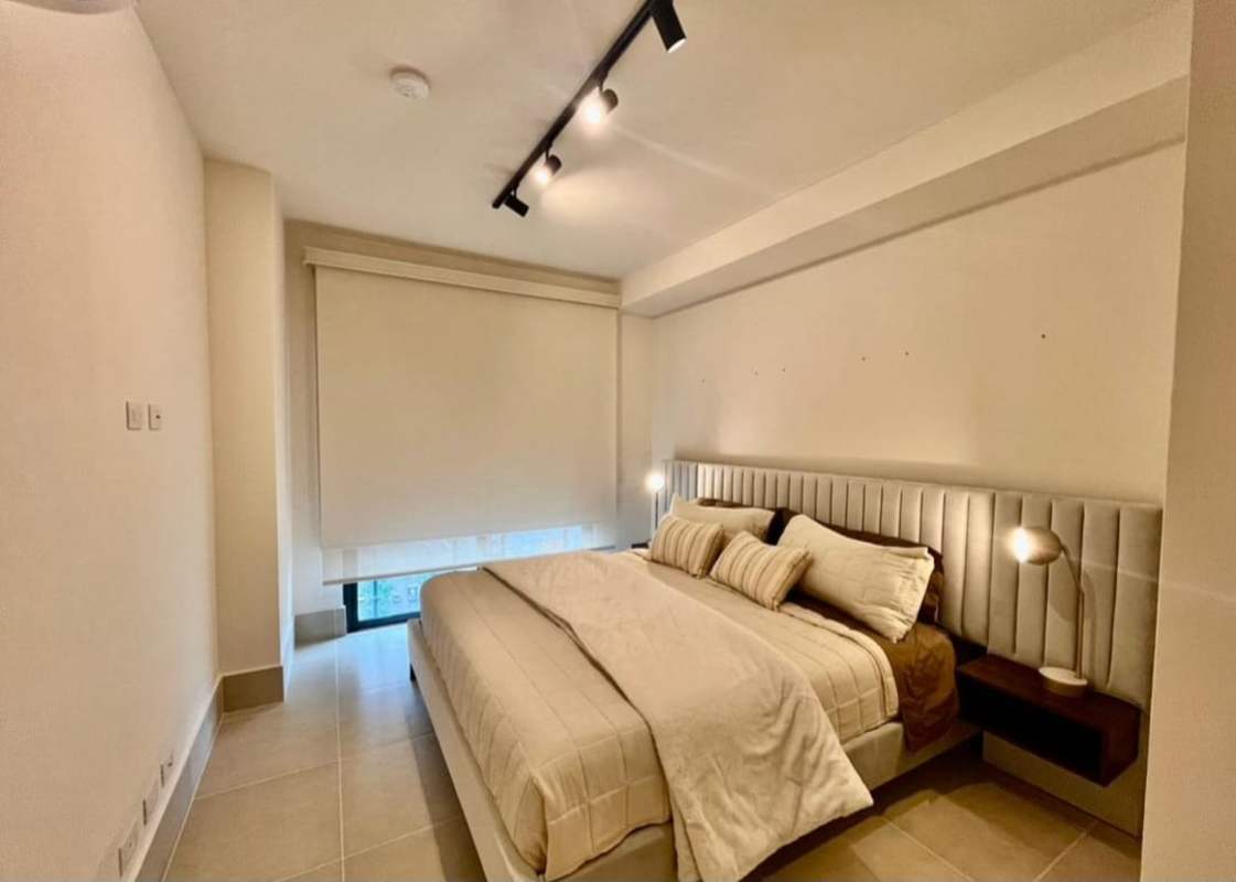 Bright living room with large window and golf view at PH Ocean House Santa Maria Panama furnished rental