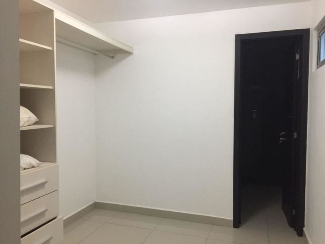 Walk-in closet with shelving and neutral walls PH Joy Tower Panama