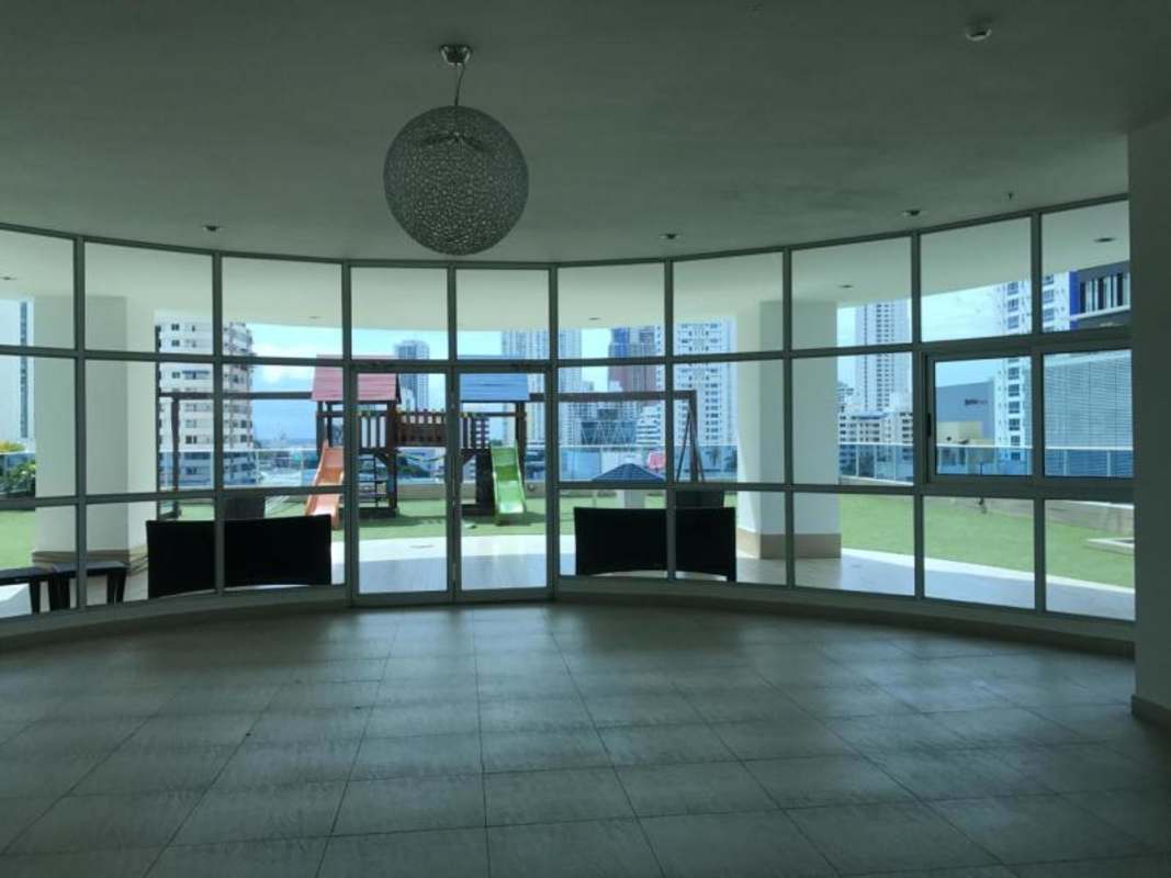 Indoor lounge area with floor-to-ceiling windows at PH Joy Tower Panama with city view