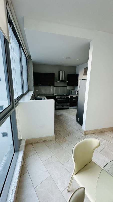 Oceanfront balcony with glass railing and panoramic views at Grand Tower Punta Pacifica Panama