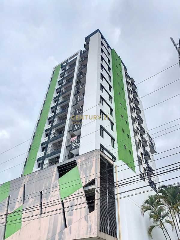 Exterior view of Vista Belle Tower condominium with balconies and green accents in Panama City