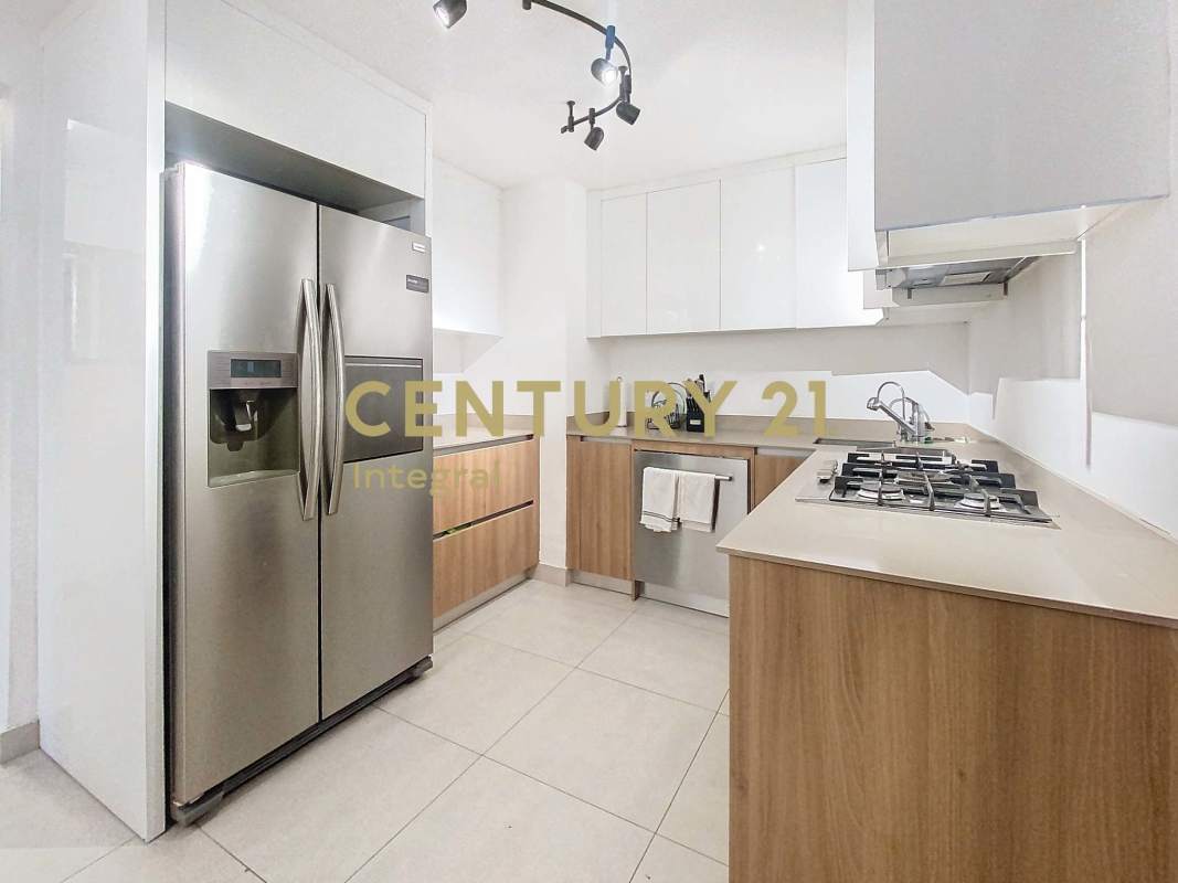 Bright living dining area with porcelain floors, large windows and balcony access PH Twin Towers Marbella