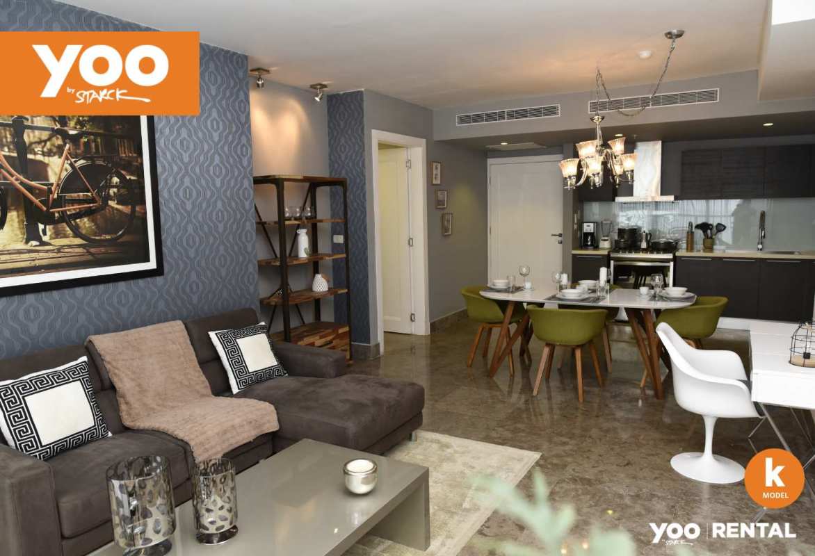 Modern open-layout living dining area with kitchen island and floor-to-ceiling windows at PH YOO Avenida Balboa