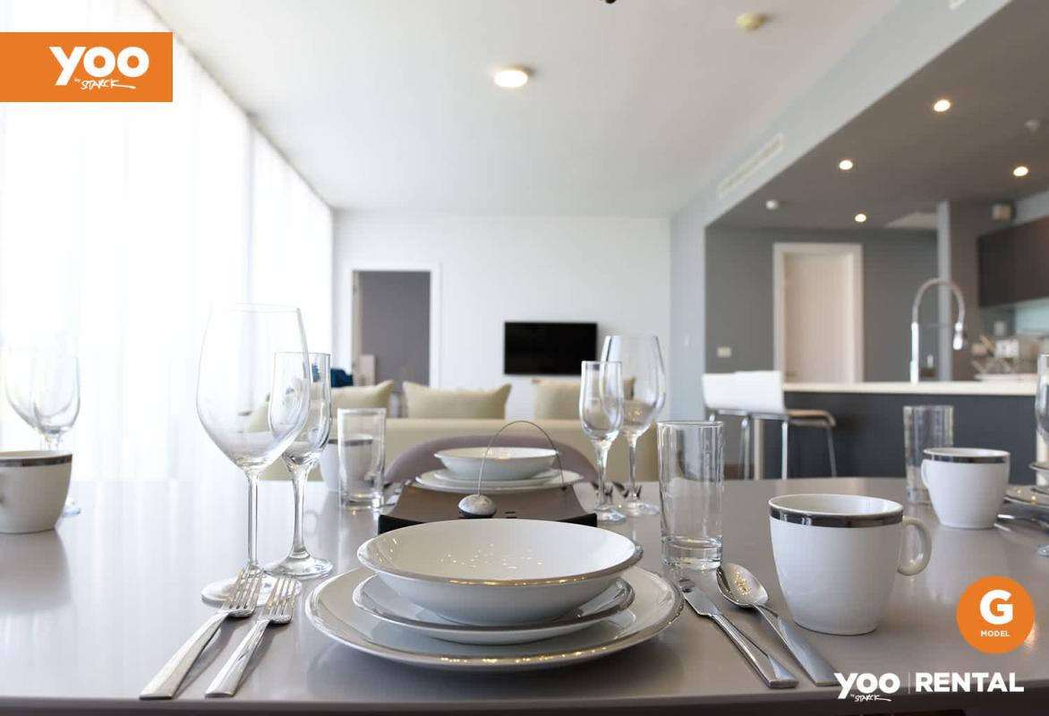 Sleek open kitchen with granite island and appliances PH Yoo Panama