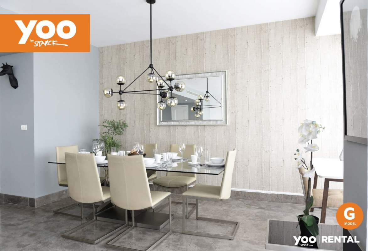 Open plan living dining space with floor-to-ceiling windows city ocean views PH Yoo Panama apartment