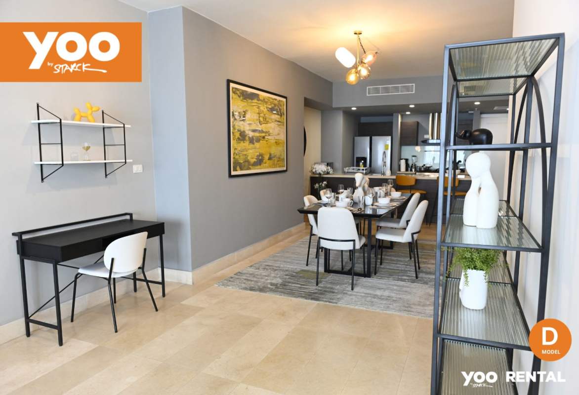 Open concept dining and living room with designer kitchen PH YOO Panama oceanfront apartment