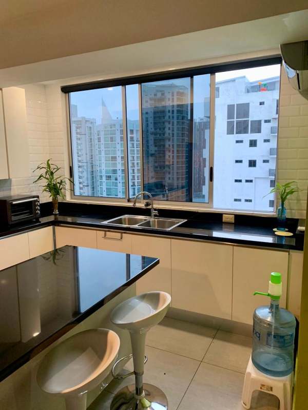 Black granite kitchen counters and stainless appliances at PH Jade Tower San Francisco