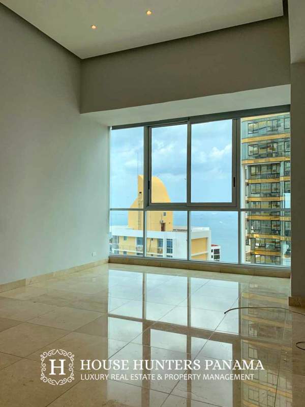 Contemporary marble bathroom with double sinks and glass shower in PH Pacific Point Punta Paitilla Panama
