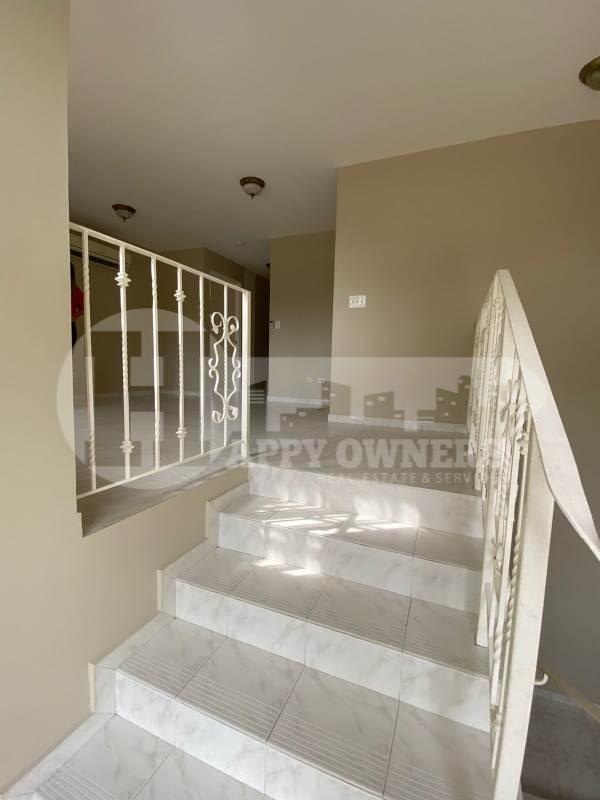 Bright entry foyer with tile flooring and chandelier PH Albrook Gardens Clayton
