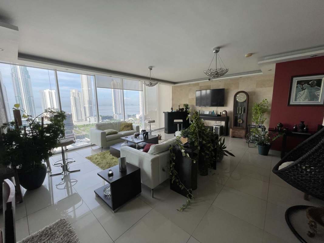 Bright kitchen with granite counters, dark cabinetry, large window in apartment PH Latitude Costa del Este Panama