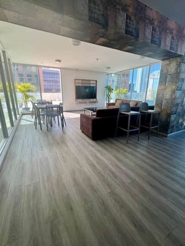 Modern gym with equipment and city panorama PH Latitude Costa del Este Panama