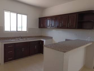 Second bedroom with white walls and tile floor in new construction Penonomé Panama