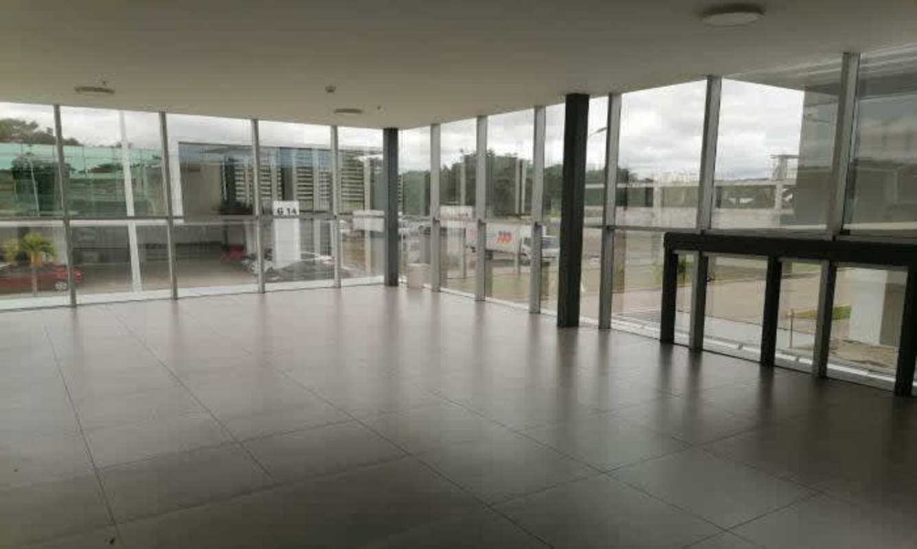 Covered garage building with signage and parking for tenants Panama Viejo Business Center