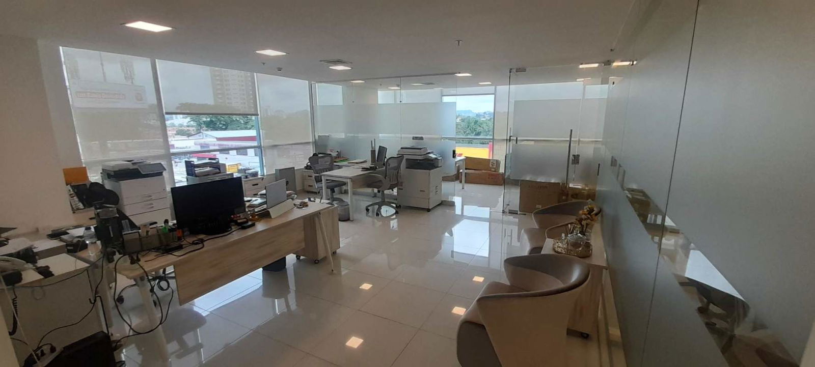Bright open workspace area with modern furnishings at PH Prime Time Panama City