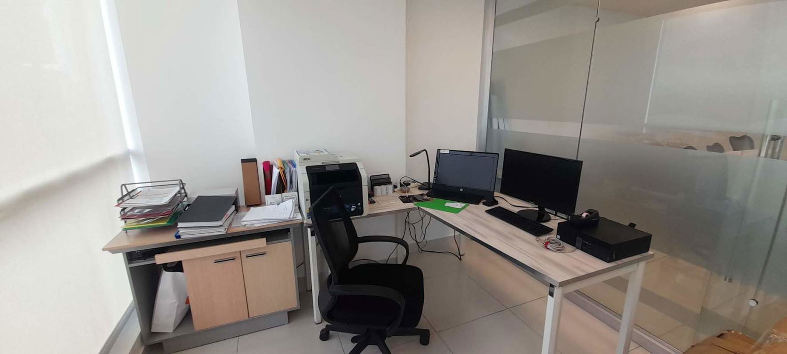 Fully equipped workspace with desks, computers and partitions at PH Prime Time Panama