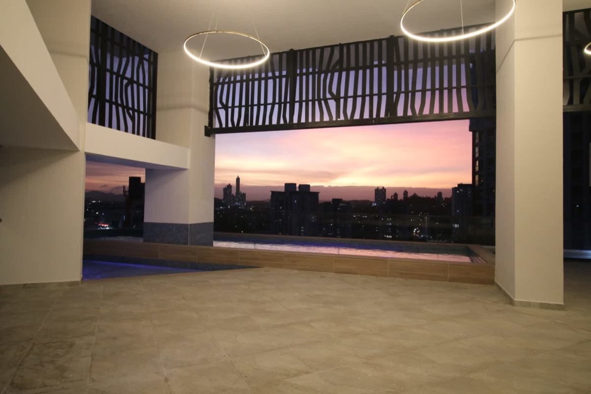 Luxury rooftop infinity pool at sunset overlooking Panama City skyline PH Bella Veduta