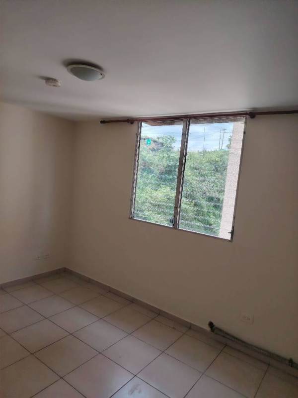 Spacious master bedroom with large window, tile floor in apartment Panama