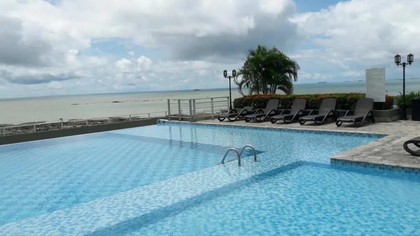 Open bright living room with balcony and city ocean views PH Terrasol Panama City