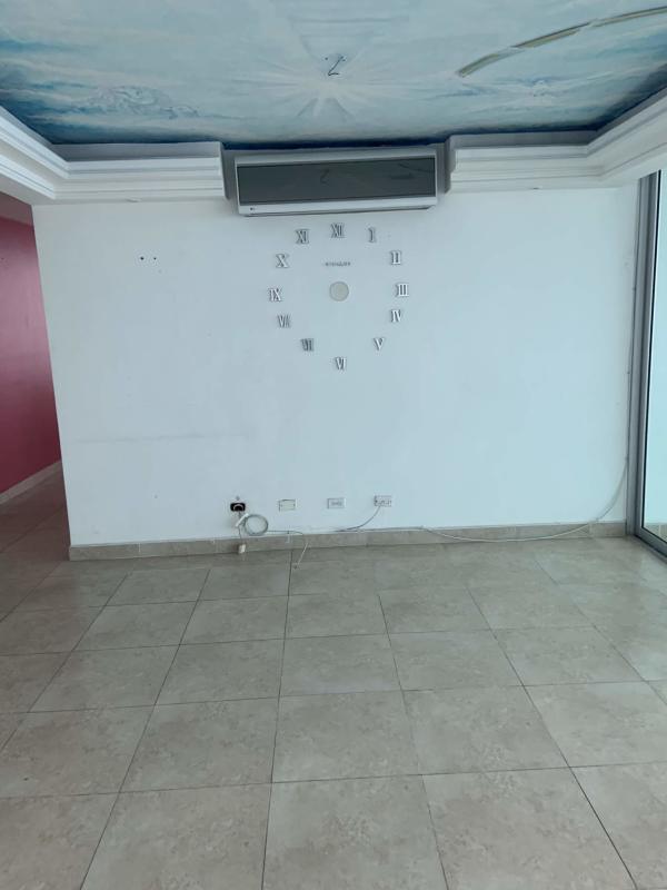 Bright bedroom with large window ocean city views at PH Terrasol San Francisco Panama