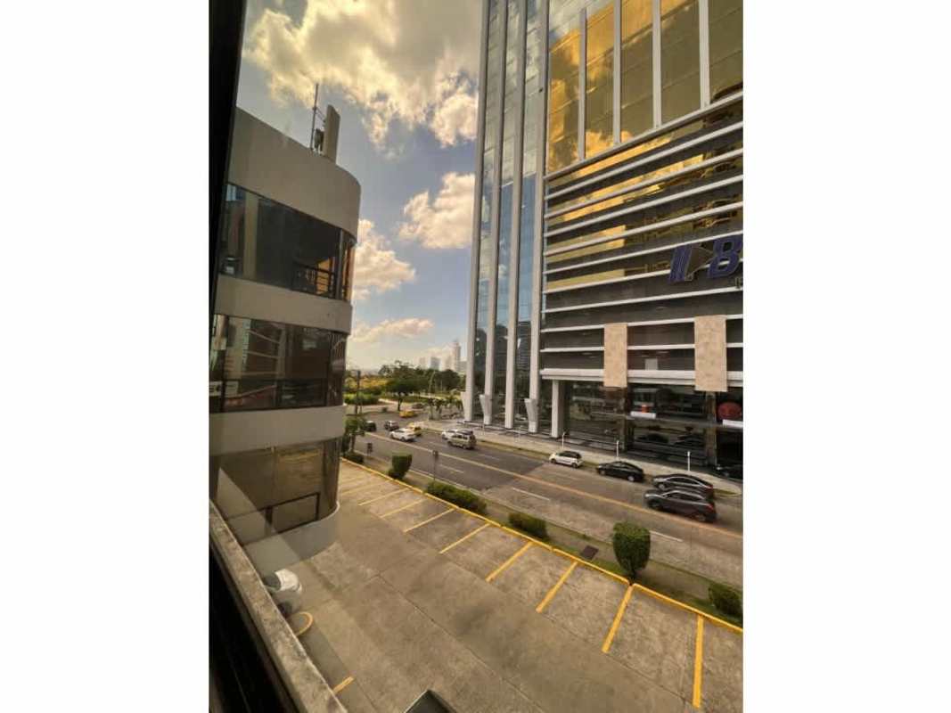 Modern business district street with glass office buildings and parking on Avenida Balboa Panama City