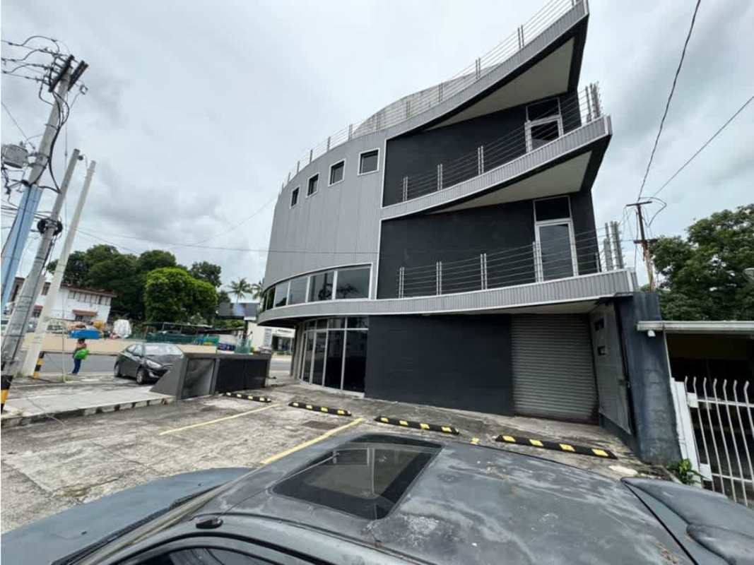 Parking lot beside rounded facade commercial building at Costa del Este Panama City