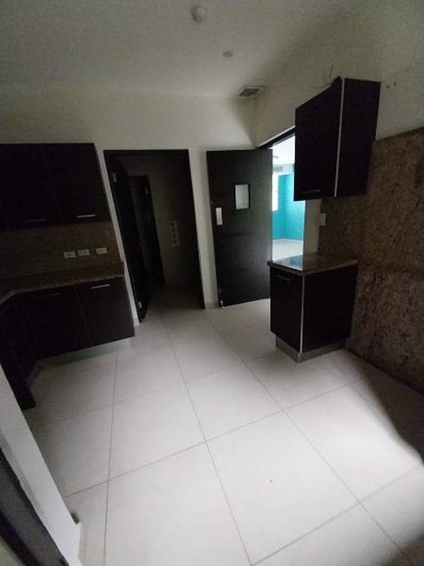 Spacious modern living room with sliding doors leading to balcony PH Embassy Village Clayton