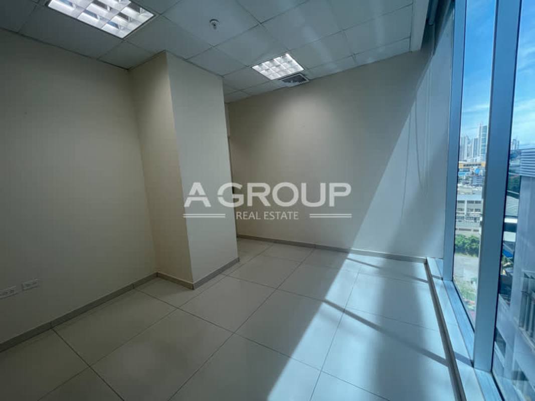 Interior hallway with glass partitions modern ceilings at PH Office One Obarrio Panama