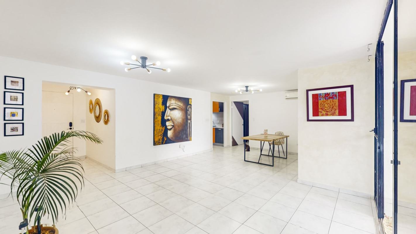 Spacious master bedroom with split AC, ceiling fan, wooden wardrobe, tiled floor in Punta Paitilla