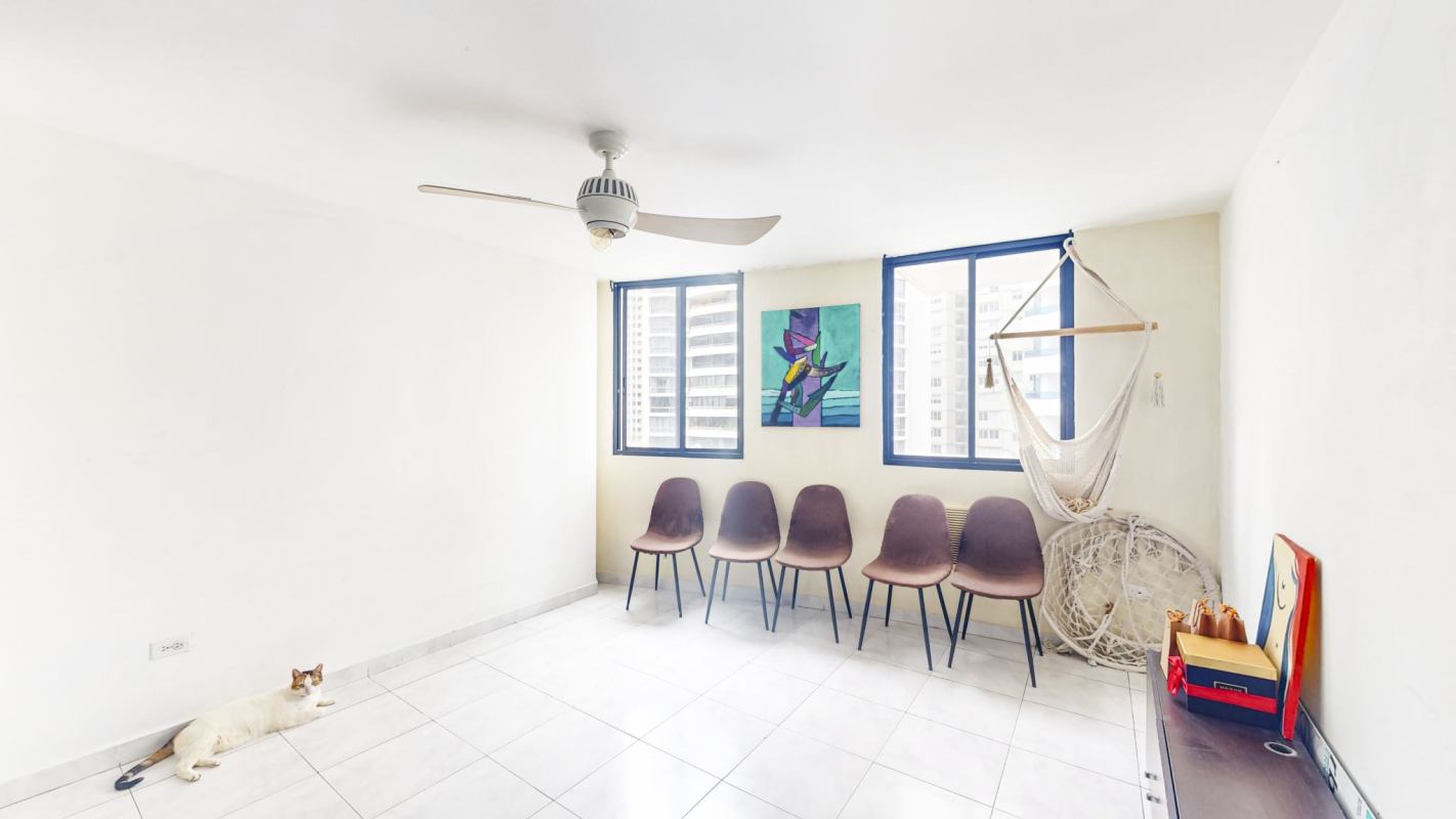 Bright family room with panoramic windows overlooking Panama City in Punta Paitilla