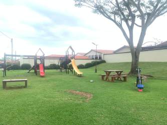 Children's park with swings and slides in Costa Verde residential community La Chorrera Panama