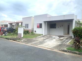 Kitchen area with cabinetry and breakfast bar in Arboledas Los Olivos home Panama
