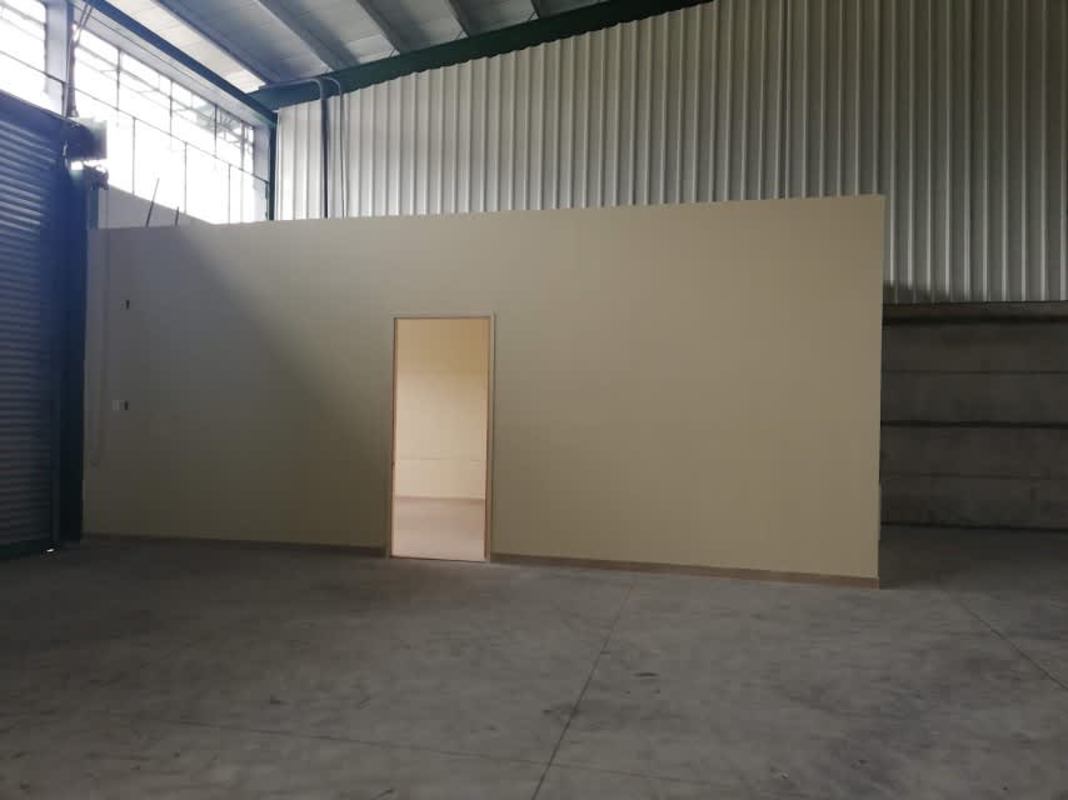 Warehouse in Villa Zaita showing large open area with windows and concrete floors Panama