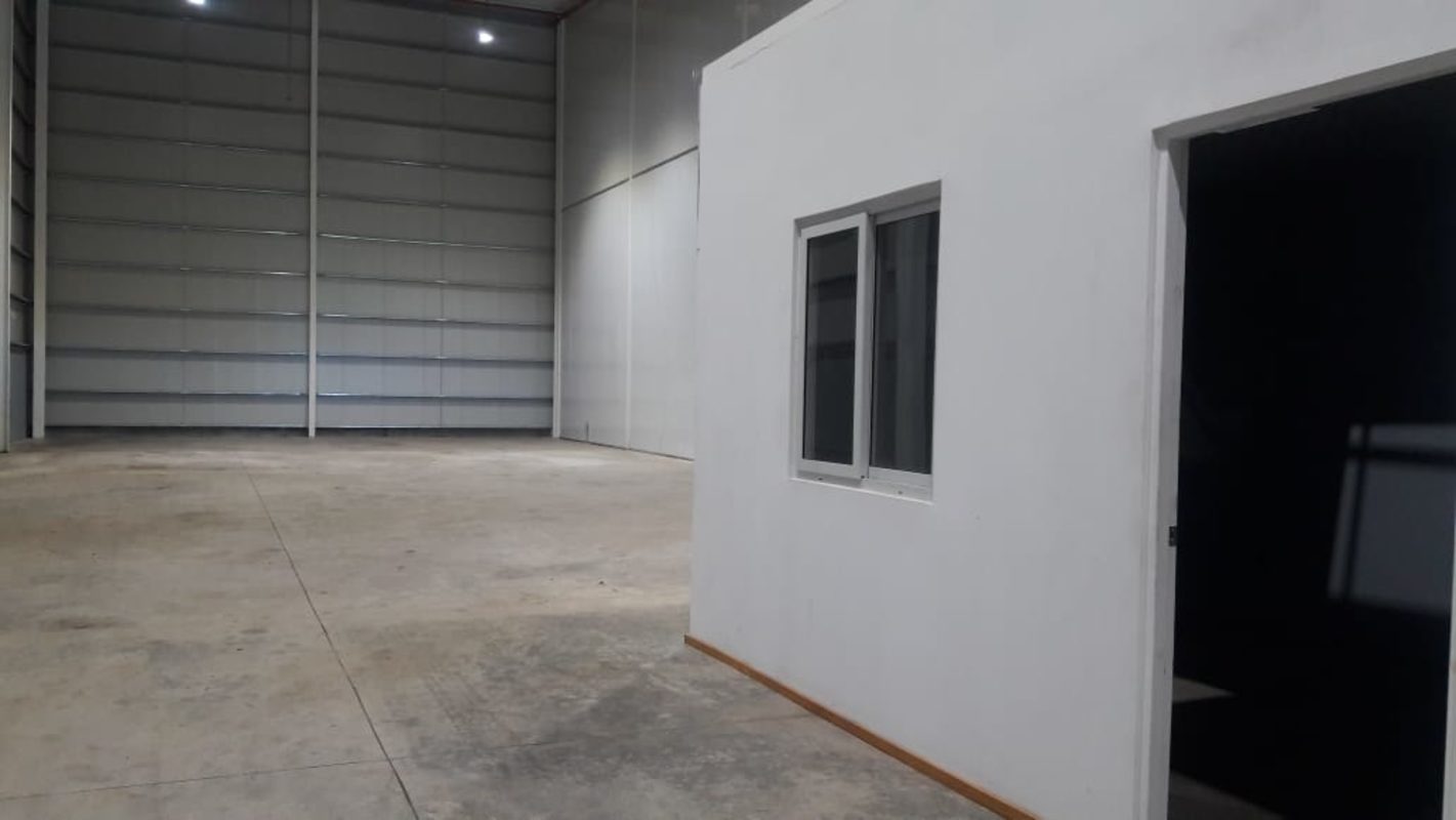 Large rolling shutter door entry for trucks in industrial warehouse PH Las Mañanitas Tocumen Panama