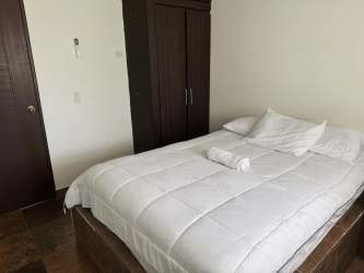 Comfortable bedroom with Smart TV AC and large bed in Panama vacation rental