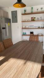 Minimalist bedroom with large window in Playa Venao beachfront condo Panama