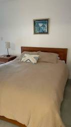 Modern kitchen dining area with wooden table and pendant lights Selina Playa Venao Panama