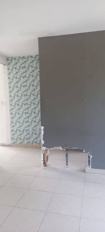 Partially demolished wall renovation scene bank repo apartment PH Vitto Pedregal Panama City