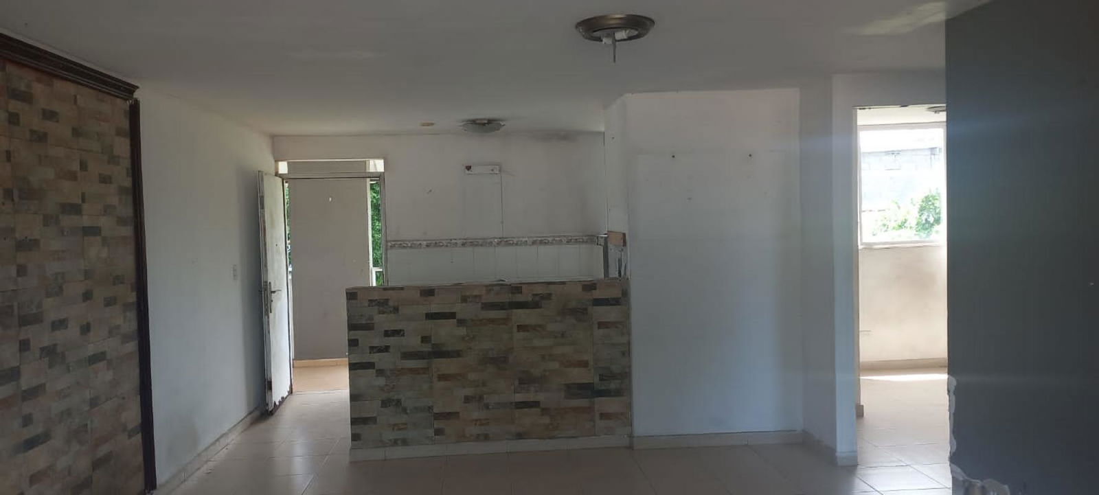 Double sink, window with bars, tiled countertop PH Vitto Pedregal bank sale Panama City