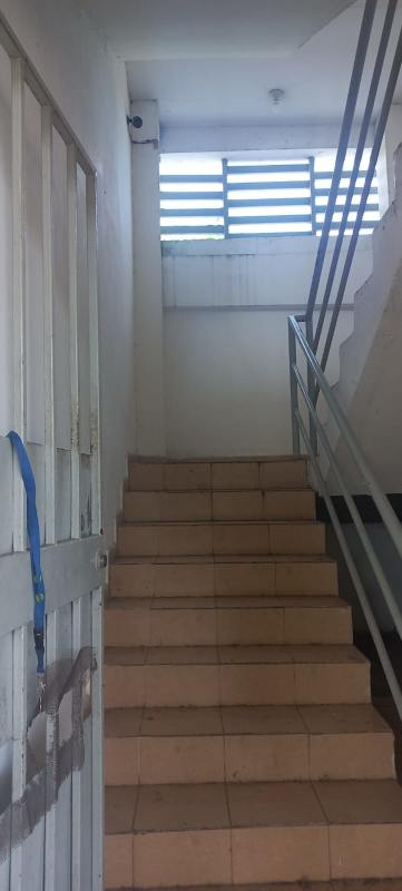 Tile stairway, safety handrails, security camera PH Vitto residential building Pedregal Panama