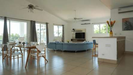 Modern double vanity bathroom with walk-in shower in Punta Barco Garden Panama beachfront condo