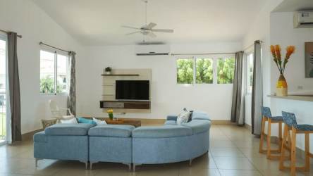 Modern beach apartment kitchen with granite countertops and breakfast bar for sale in Punta Barco Panama