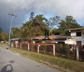 Charming cabin with front porch surrounded by lush gardens at mountain estate El Valle Panama for sale