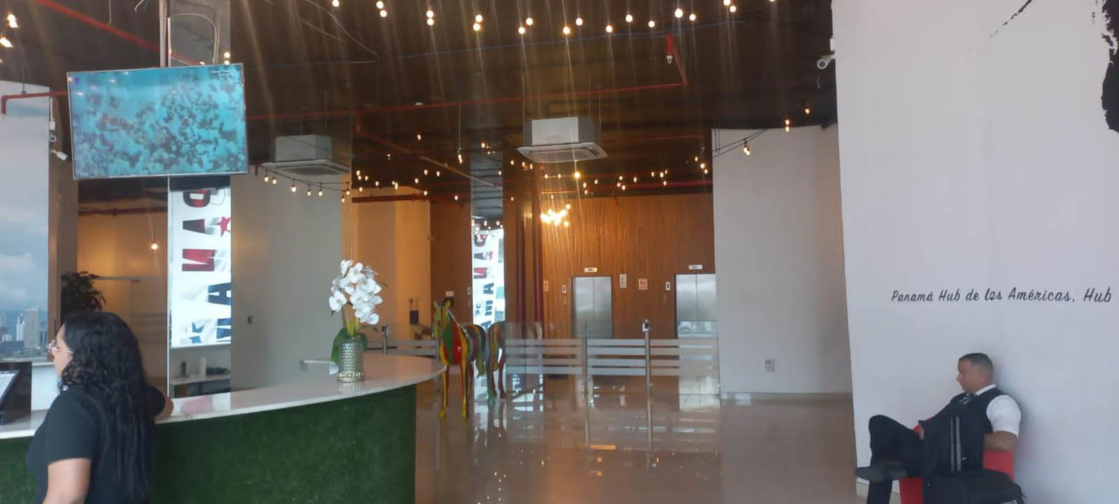 Bedroom space with large window overlooking Panama City from Bay View Tower Avenida Balboa