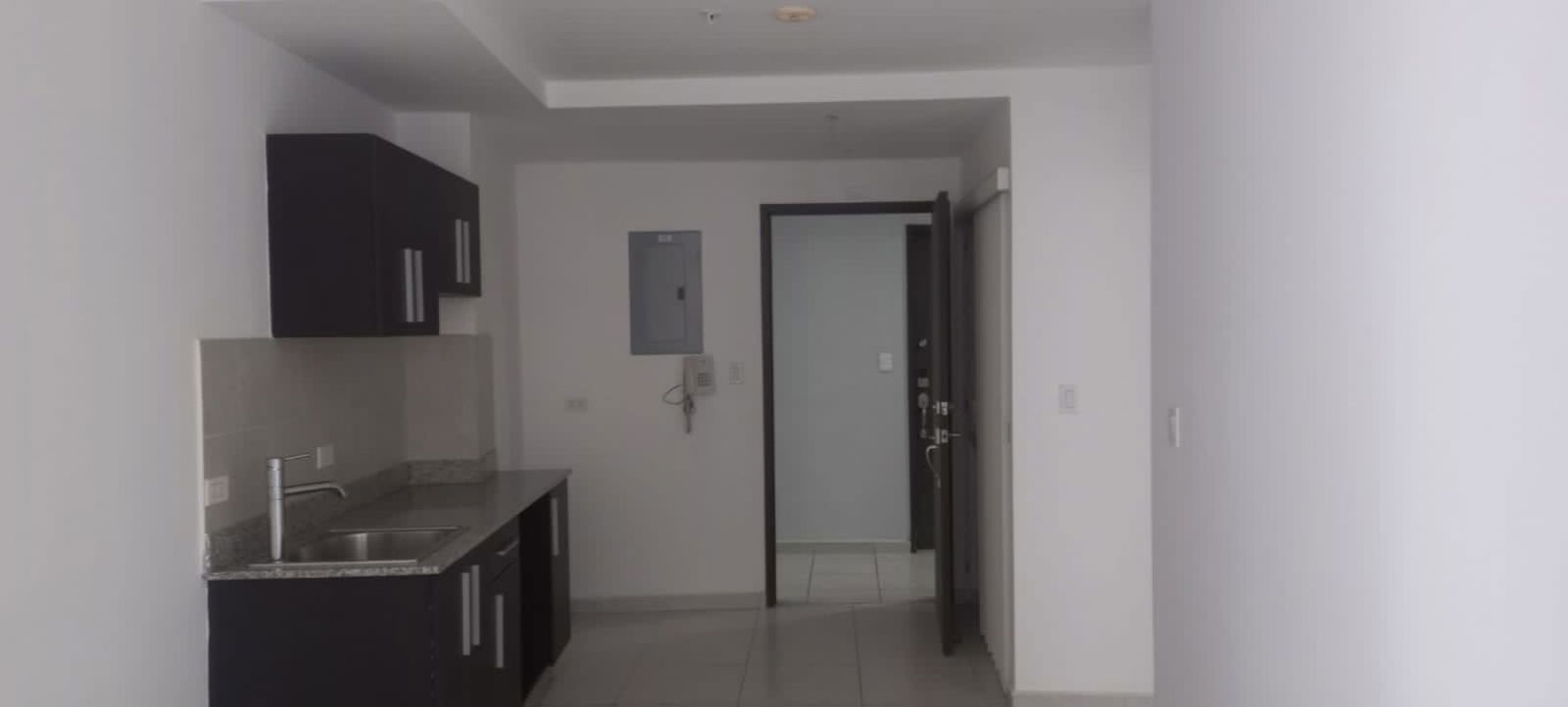 Living-dining area with bright window and balcony in PH Bay View Avenida Balboa Panama